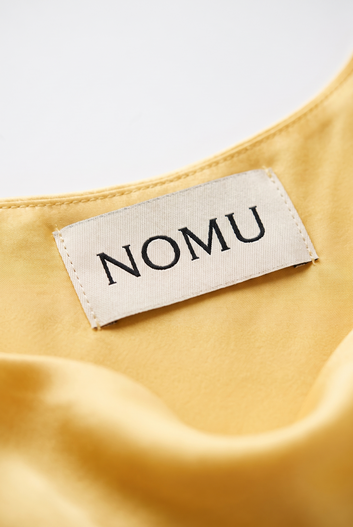 NOMU-AI label